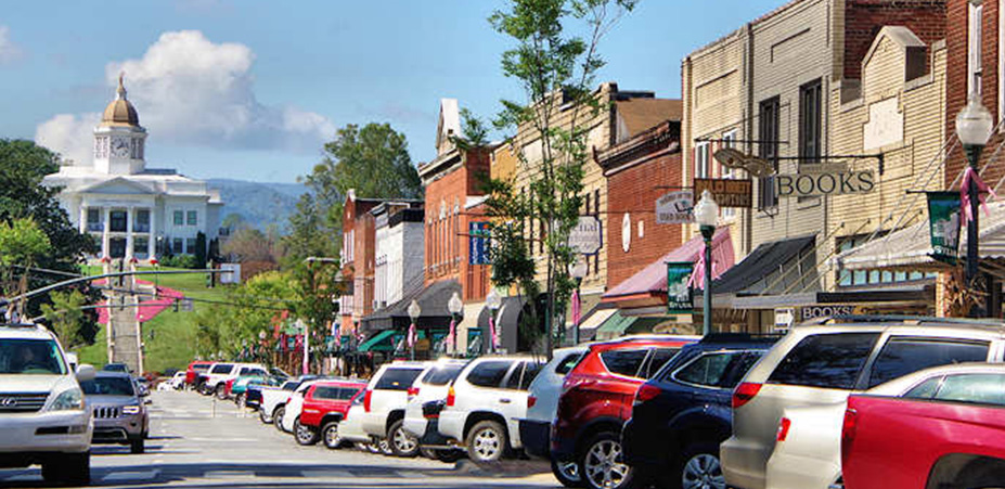 Sylva, NC, just northwest of Bear Lake. Shown is a strip of small shops.