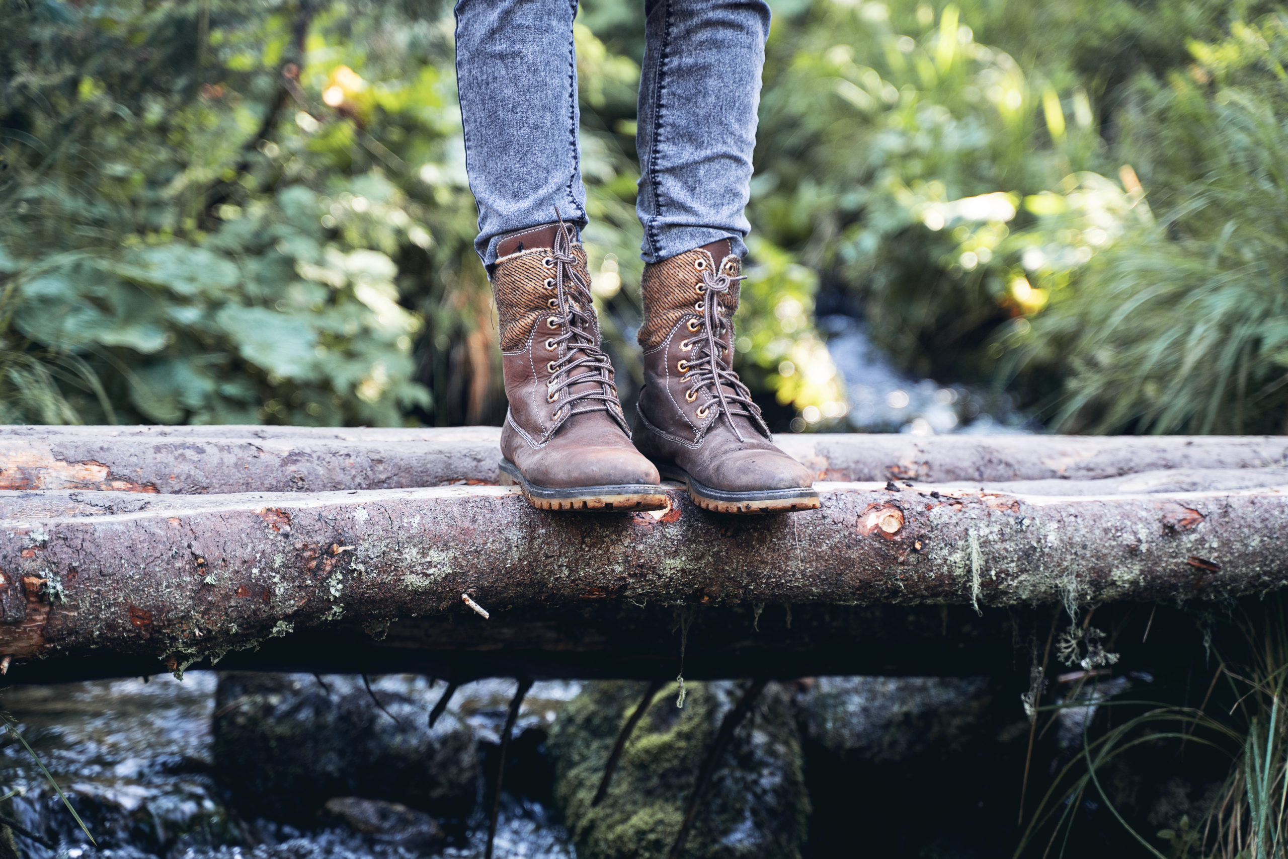 closeup of woman hiking boots on wooden bridge in 2021 08 28 21 59 54 utc scaled